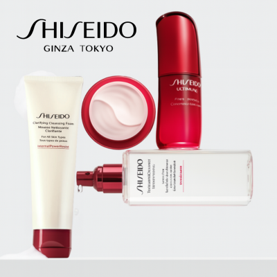 Shiseido Hautpflege-Produkte auf hellem Hintergrund, darunter die Clarifying Cleansing Foam Reinigungscreme, die Ultimune Power Infusing Concentrate Pflege, eine geöffnete Creme-Dose mit rosafarbener Textur und eine klare Flasche mit Pumpspender – alle in markentypischem Weiß-Rot-Design mit dem Shiseido Ginza Tokyo Logo.